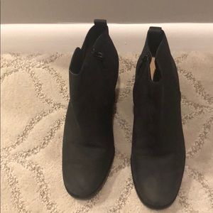 Women’s black leather Cole Haan ankle boots.